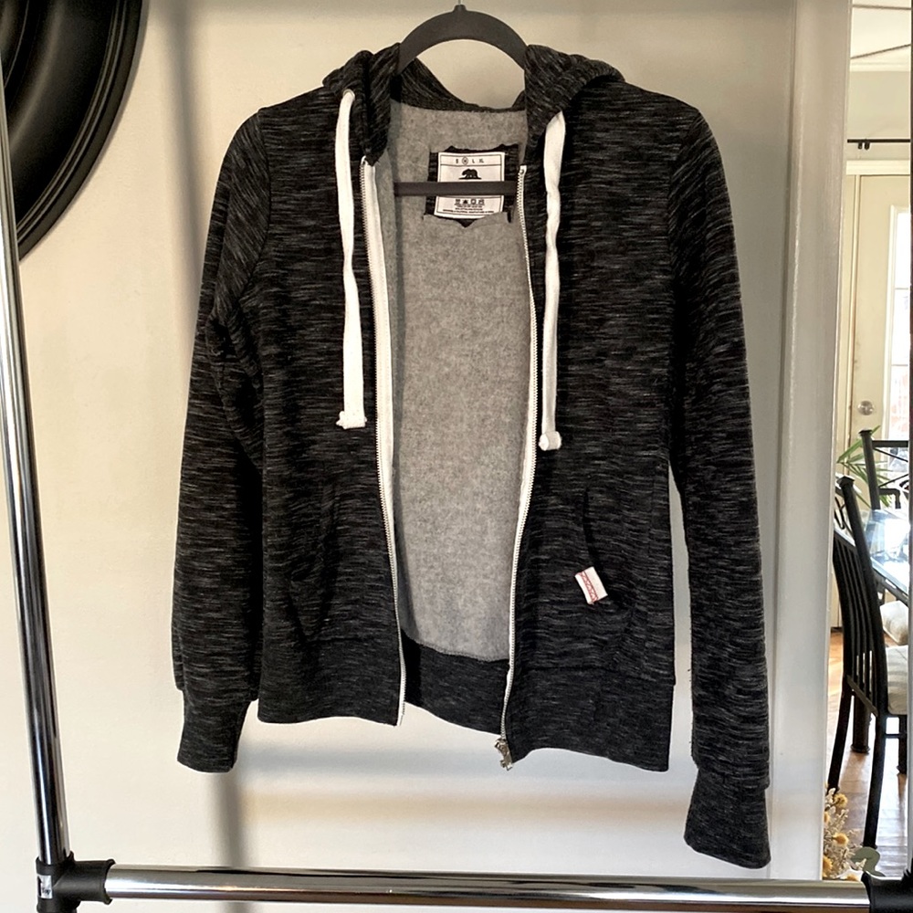 Zip front hooded sweatshirt.